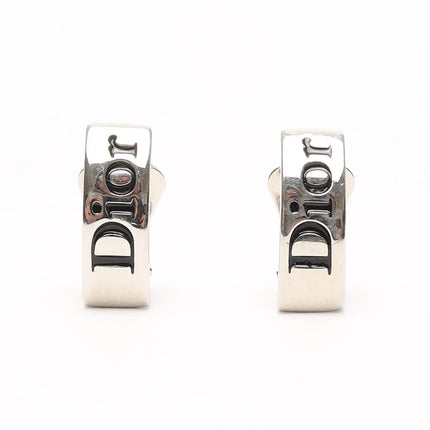 Christian Dior clip earrings in silver with black Dior logo.